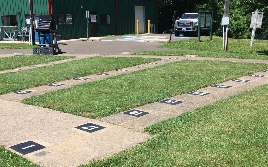 painted distance markings, white painted numbers on pavement