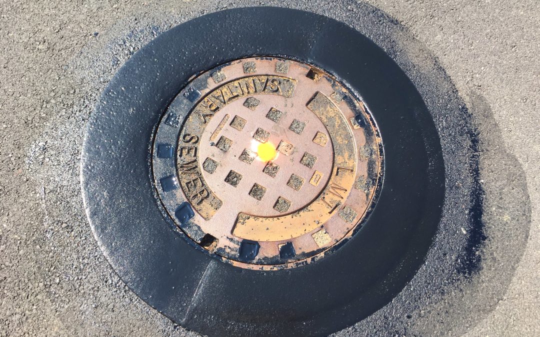 manhole protection rings are made of a preformed thermoplastic material so that snow plow blades don't catch the edge